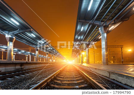 Railway station at night. Train platform in fog 17994790