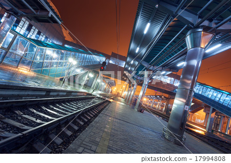 Railway station at night. Train platform in fog 17994808
