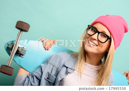 Cheerful girl standing on blue background  17995530