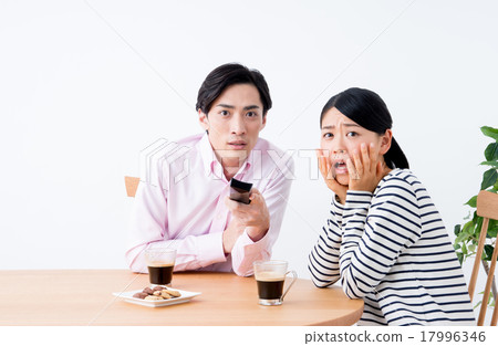 Young couple (watching TV) Young couple (watching TV) 17996346