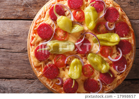 pizza with salami and pepper top view , rustic 17998657