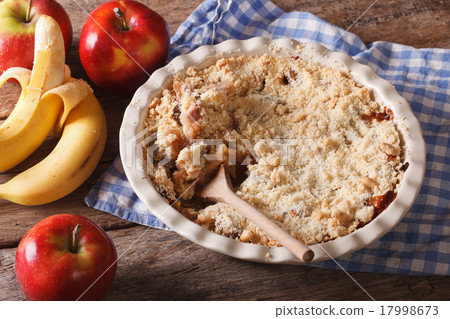 Crumble with apple and banana close-up, rustic Crumble with apple and banana close-up, rustic 17998673