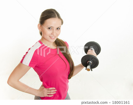 Self-confident athlete with dumbbells in hand 18001161