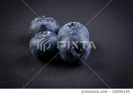 Blueberries on stone plate background 18006140