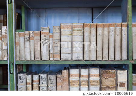 historic old books in library, wooden bookshelf 18006619
