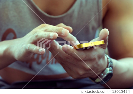 lifestyle young man using a mobile phone lifestyle young man using a mobile phone 18015454