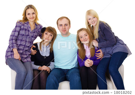 Big family on couch - four women and one man 18018202