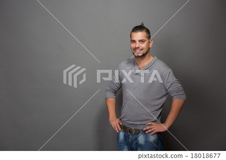 Fashionable hipster man posing with hands on hips 18018677