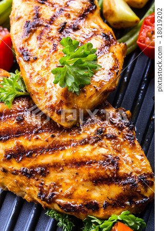 Grilled chicken breast in different variations 18019202