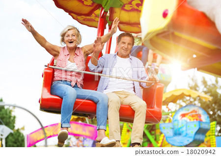 Senior couple in amusement park 18020942