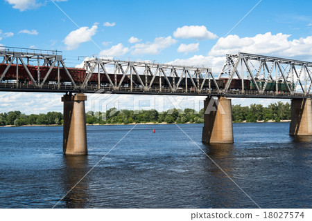 Railroad bridge across with freight train Railroad bridge across with freight train 18027574