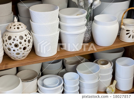 white planters in the florist shop white planters in the florist shop 18027857