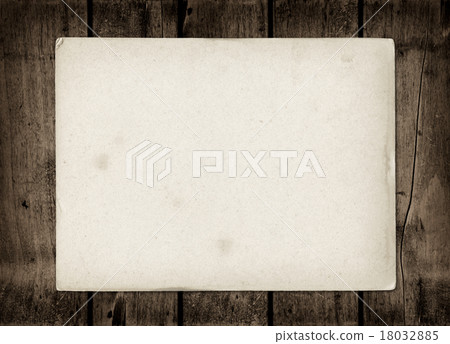 Old textured paper sheet on a dark wood table Old textured paper sheet on a dark wood table 18032885