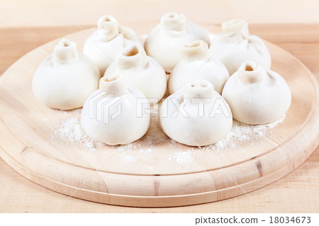 Manti dumplings on a wooden board 18034673