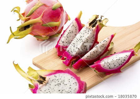 Four Fruit Wedges Of A Cut Pitaya On Cutting Board 18035870