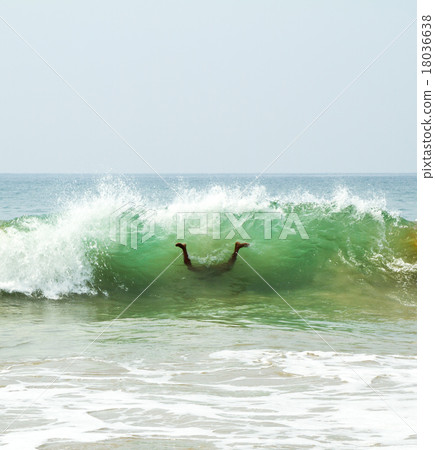 Diving swimmer in a funny upside-down pose 18036638