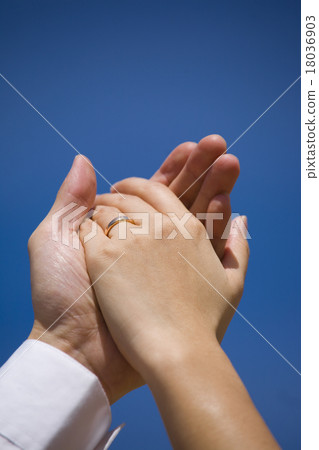 Couple holding hands with wedding ring Couple holding hands with wedding ring 18036903
