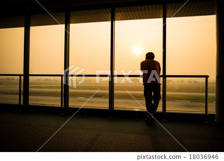 Silhouette of man waiting for the flight Silhouette of man waiting for the flight 18036946