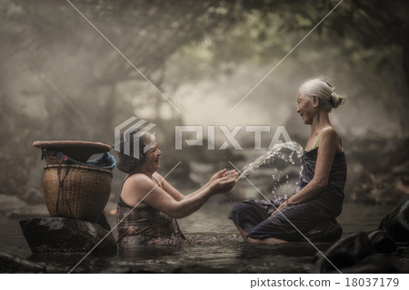 Old Asian woman in cascade 18037179