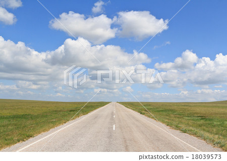 The asphalt road straight going beyond the horizon The asphalt road straight going beyond the horizon 18039573