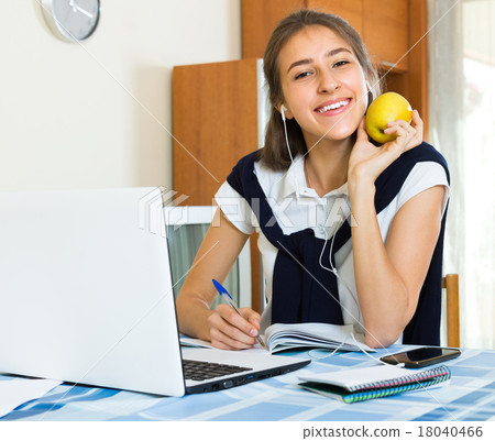Teenager girl doing homework . 18040466