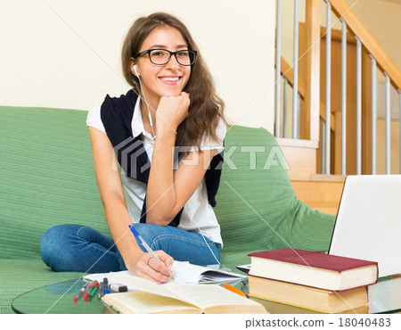 Teenager girl doing homework Teenager girl doing homework 18040483