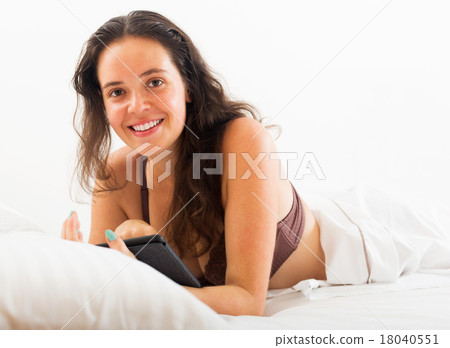 Woman with tablet in bed 18040551