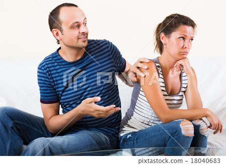 Sad partner asking for forgiveness 18040683