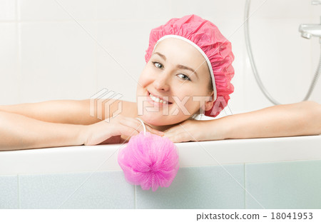 portrait of cute smiling woman posing in bath 18041953