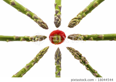 Eight Asparagus Spears Pointing at One Strawberry 18044544
