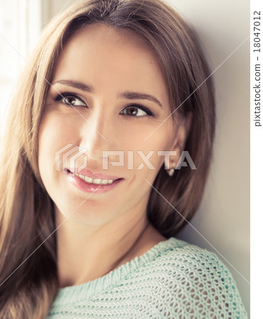 Toned image of attractive young woman relaxing and dreaming Toned image of attractive young woman relaxing and dreaming 18047012
