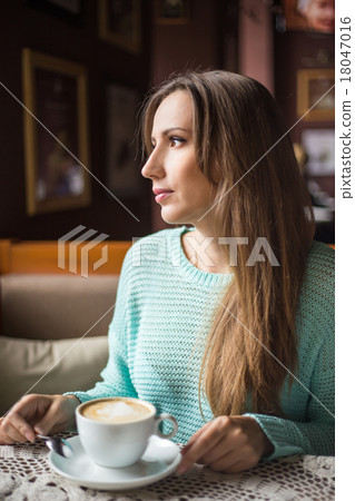 The image of a beautiful girl in a cafe The image of a beautiful girl in a cafe 18047016