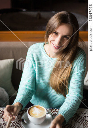 Charming woman in a restaurant Charming woman in a restaurant 18047018