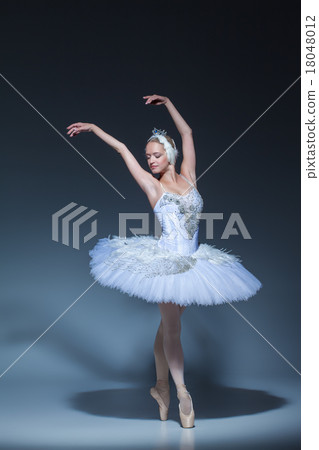 Portrait of the ballerina in ballet tatu on blue 18048012