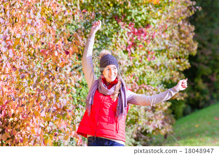 Woman enjoying fall or autumn in nature Woman enjoying fall or autumn in nature 18048947