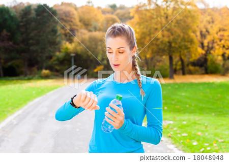 Woman running in autumn forest Woman running in autumn forest 18048948