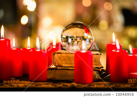 Crystal ball in the candle light to prophesy 18048958