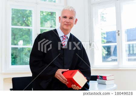 Trial Lawyer in his law firm Trial Lawyer in his law firm 18049028