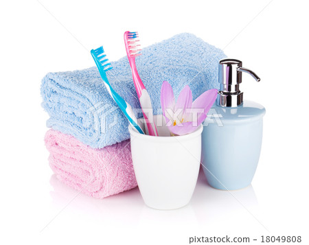 Toothbrushes, soap, two towels and flower Toothbrushes, soap, two towels and flower 18049808
