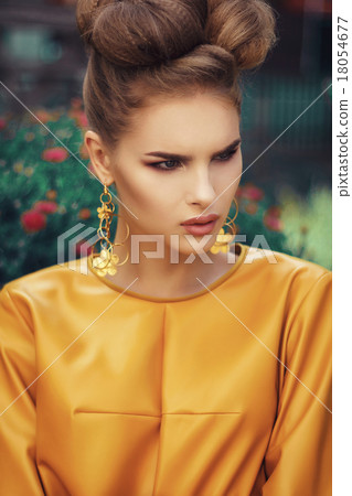 Beautiful girl in yellow dress with curly hair 18054677