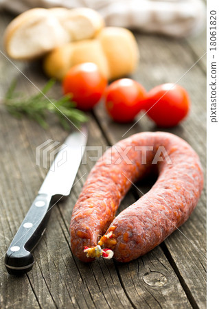 Chorizo sausage on wooden table 18061820