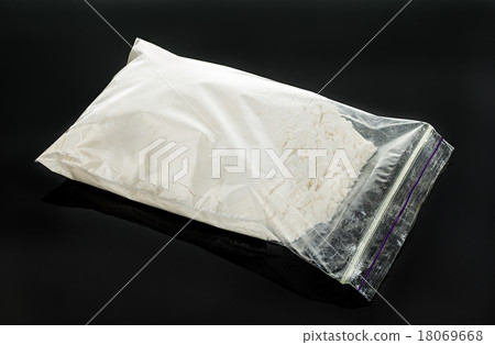 Drug powder close-up on a black background. Drug powder close-up on a black background. 18069668