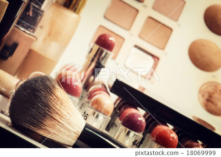Makeup and eye shadows with cosmetic brush Makeup and eye shadows with cosmetic brush 18069999