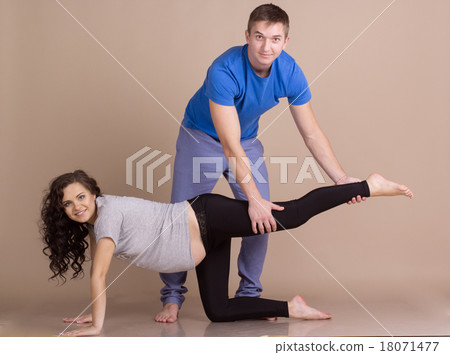 Pregnant girl and man doing sports together 18071477