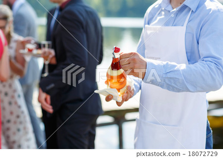 Waiter with bottle of champagne on wedding 18072729