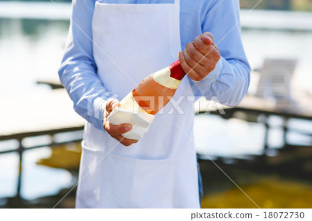 Waiter with bottle of champagne on wedding 18072730