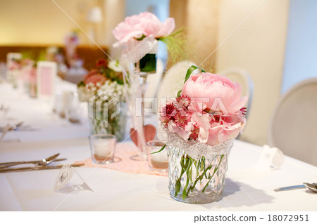 Table set in pink and white for wedding or event party. 18072951