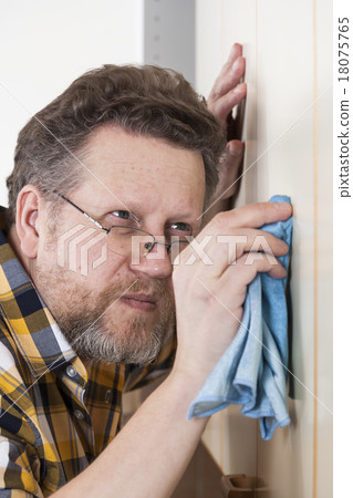 Man doing household chores Man doing household chores 18075765
