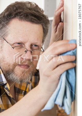 Man doing household chores Man doing household chores 18075767