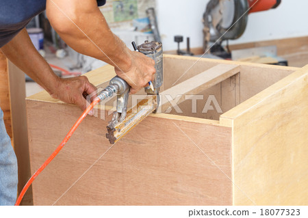 carpenter used air-gun for make new furniture carpenter used air-gun for make new furniture 18077323